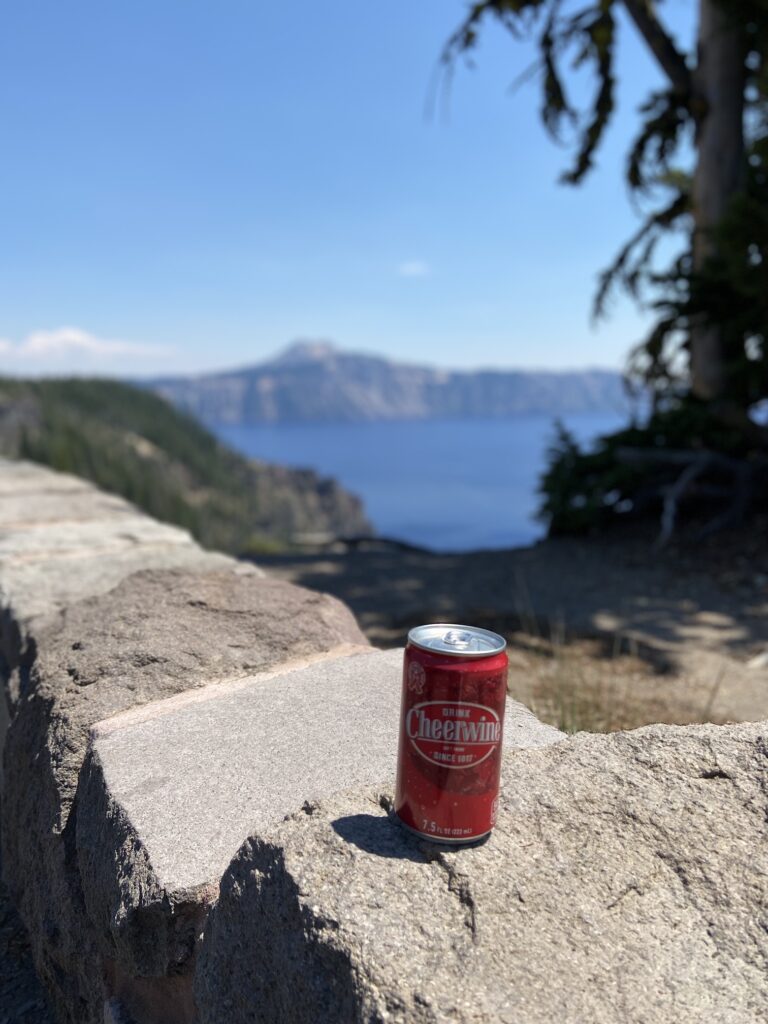 Can of Cheerwine with Crater Lake in the background